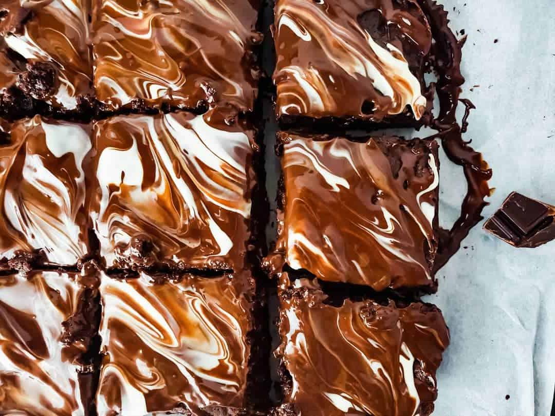 Overhead shot of brownies on parchment paper.