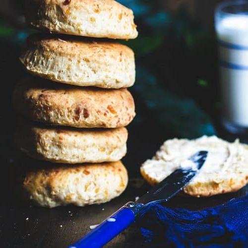 Five homemade biscuits stacked on top of each other.
