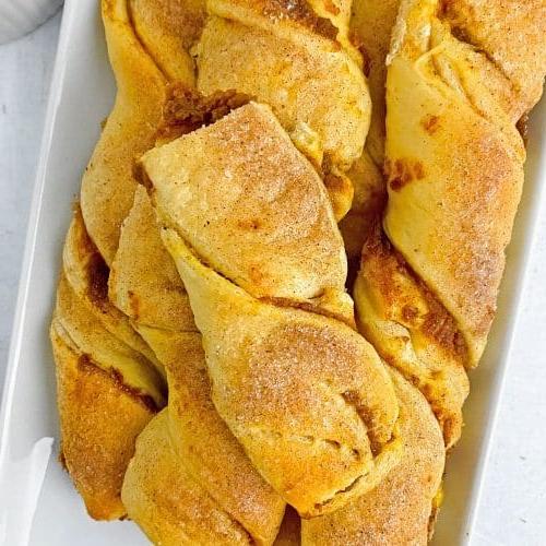Pumpkin pie pastry strips on a serving plate