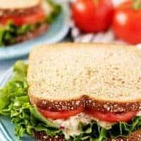 The finished sandwich, on whole wheat bread, with lettuce and tomato.